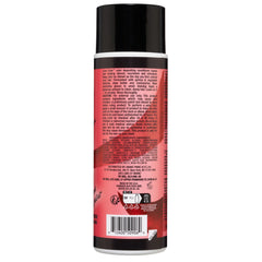 Back view of a black cylindrical Manic Panic® LOVE COLOR™ RED DESIRE CONDITIONER bottle with red and white text detailing product information and ingredients, featuring Manic Panic Love color branding.