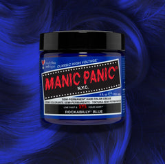 Manic Panic Classic High Voltage semi-permanent hair dye in shade Rockabiilly Blue a vibrant, vegan hair color. Image shows a jar of Rockabiilly Blue hair dye placed on top of a wavy bold  blue hair swatch.
