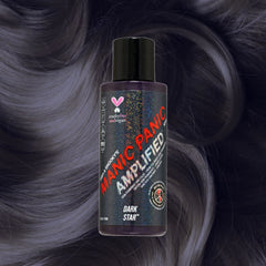 Manic Panic Amplified Dark Star gray-purple hair dye bottle on smoky silver wavy hair.