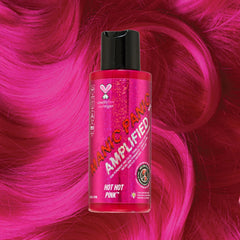 Manic Panic Amplified Hot Hot Pink bottle on bright pink wavy hair background.