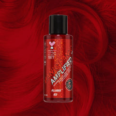 Manic Panic Amplified Pillarbox Red semi-permanent hair dye on vibrant red wavy hair background