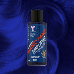 Manic Panic Amplified Shocking Blue semi-permanent dye bottle on royal blue wavy hair