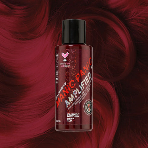 Manic Panic Amplified Vampire Red semi-permanent dye bottle on dark burgundy hair background.