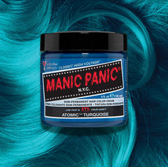 Manic Panic Classic High Voltage semi-permanent hair dye in shade Atomic Turquoise a vibrant, vegan hair color. Image shows a jar of Atomic Turquoise hair dye placed on top of a wavy blue green turquoise hair swatch.
