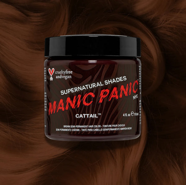 Manic Panic Classic High Voltage semi-permanent hair dye in shade Cattail a vibrant, vegan hair color. Image shows a jar of Cattail hair dye placed on top of a wavy medium brown  hair swatch.
