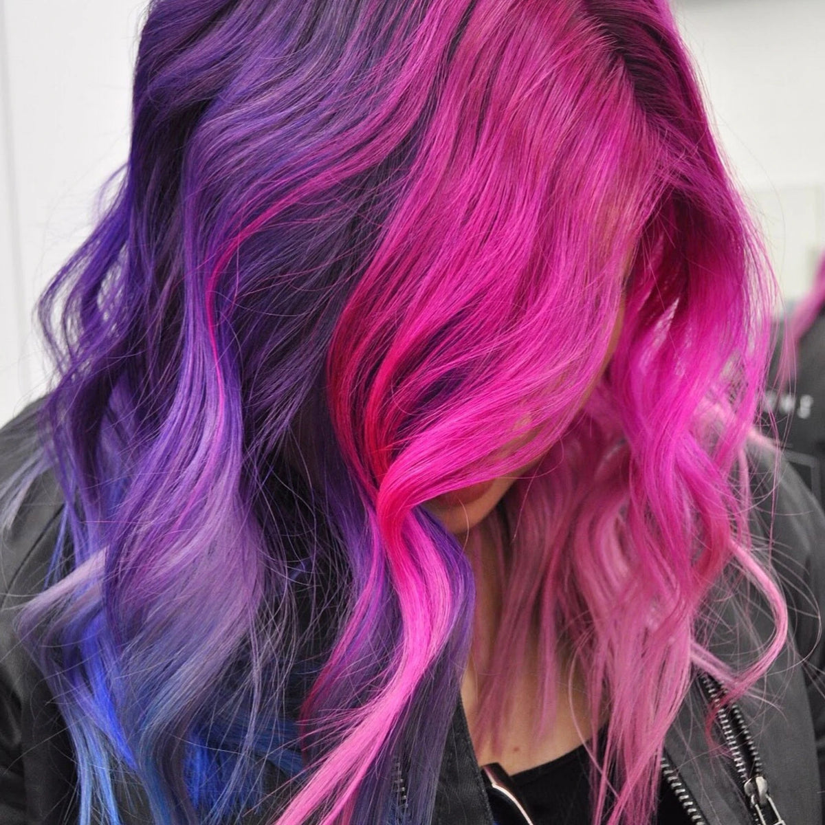 Wavy hair dyed bright pink, purple, and blue using Manic Panic Classic High Voltage semi-permanent hair color.
