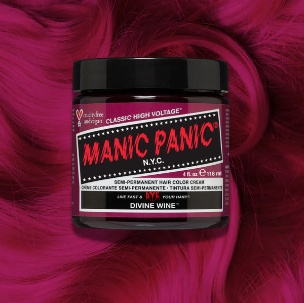 Manic Panic Classic High Voltage semi-permanent hair dye in shade Divine Wine a vibrant, vegan hair color. Image shows a jar of Divine Wine hair dye placed on top of a wavy red pink hair swatch.
