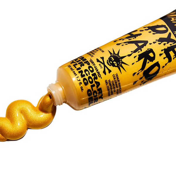 Tube of Manic Panic Dye Hard Temporary Hair Color Gel in Glam Gold Metallic with shiny yellow gold gel squeezed out