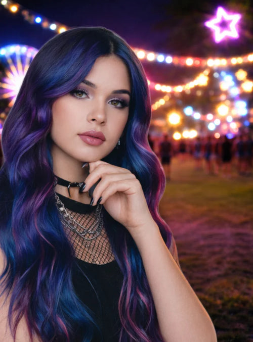 Model with purple and blue gel hair color at a nighttime festival, showcasing Manic Panic Inter-GEL-actic™ semi-permanent hair dye.