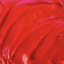 Close-up of a bright red hair dye swatch