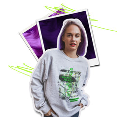 Person wearing a gray sweatshirt with text, surrounded by polaroid-style images of purple hair.