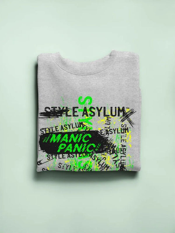 Folded gray sweatshirt with 'Manic Panic' and 'Style Asylum' text on a light green background