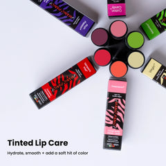 Manic Panic tinted lip balm shade range with open balm sticks showing sheer color payoff in vegan hydrating lip care formula