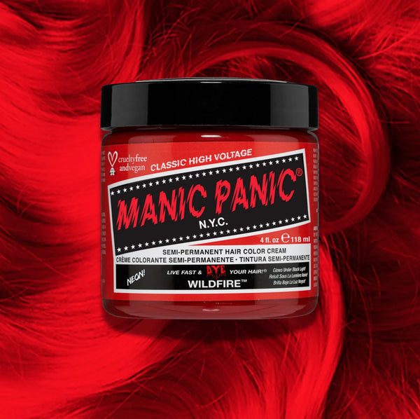 Manic Panic Classic High Voltage semi-permanent hair dye in shade Wildfire a vibrant, vegan hair color. Image shows a jar of Wildfire hair dye placed on top of a wavy red orange hair swatch.
