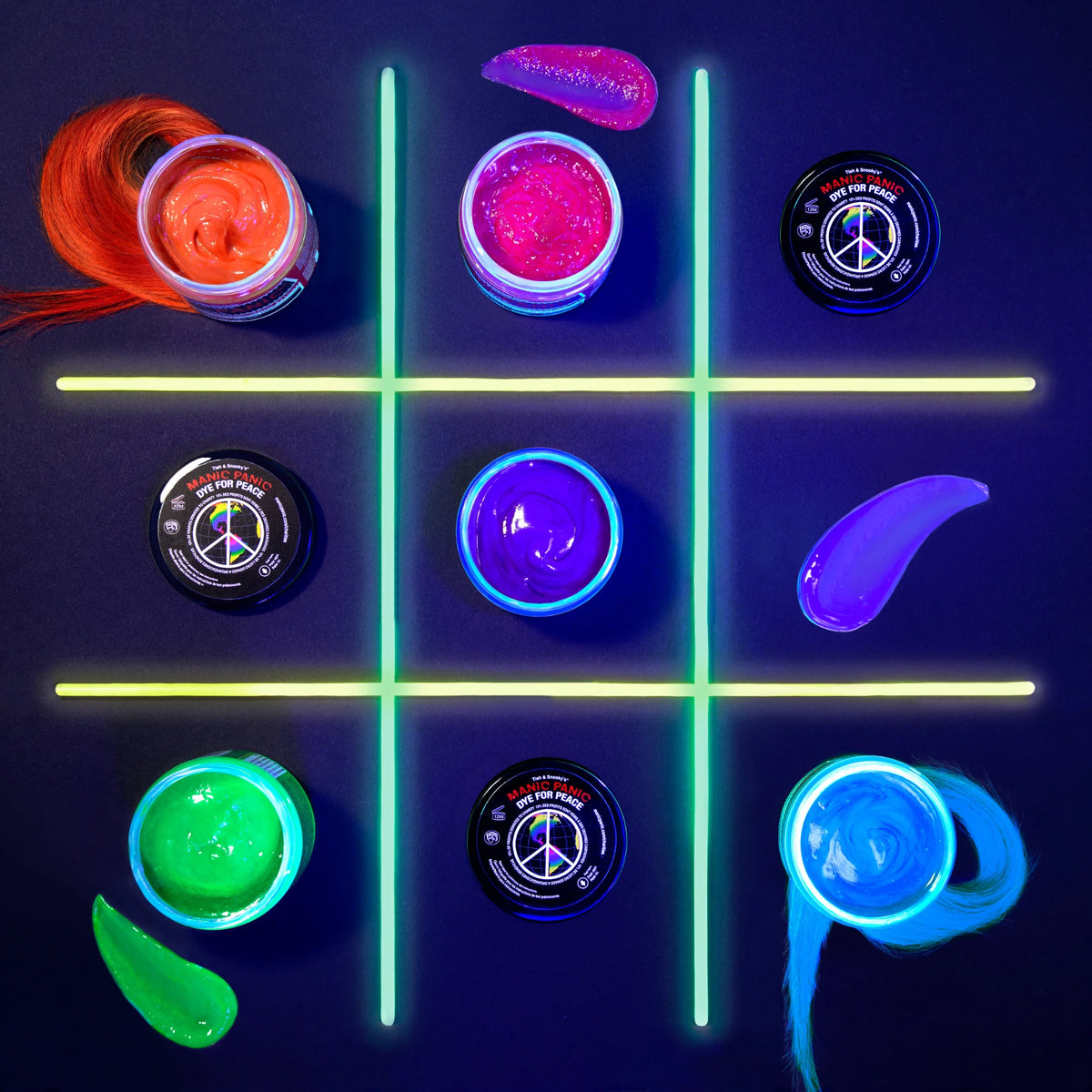 Glow-in-the-dark Classic Manic Panic hair dye arranged in a tic-tac-toe game on a dark background.